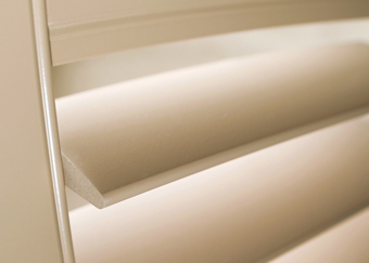 tan shutters wide wooden slats brown